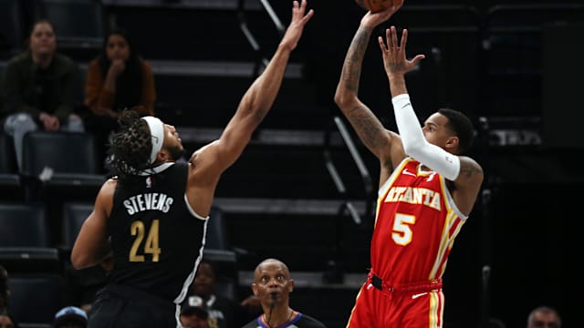 Mar 8, 2024; Memphis, Tennessee, USA; Atlanta Hawks guard Dejounte Murray (5) shoots as Memphis Grizzlies forward Lamar Stevens (24) defends during the second half at FedExForum. Mandatory Credit: Petre Thomas-USA TODAY Sports
